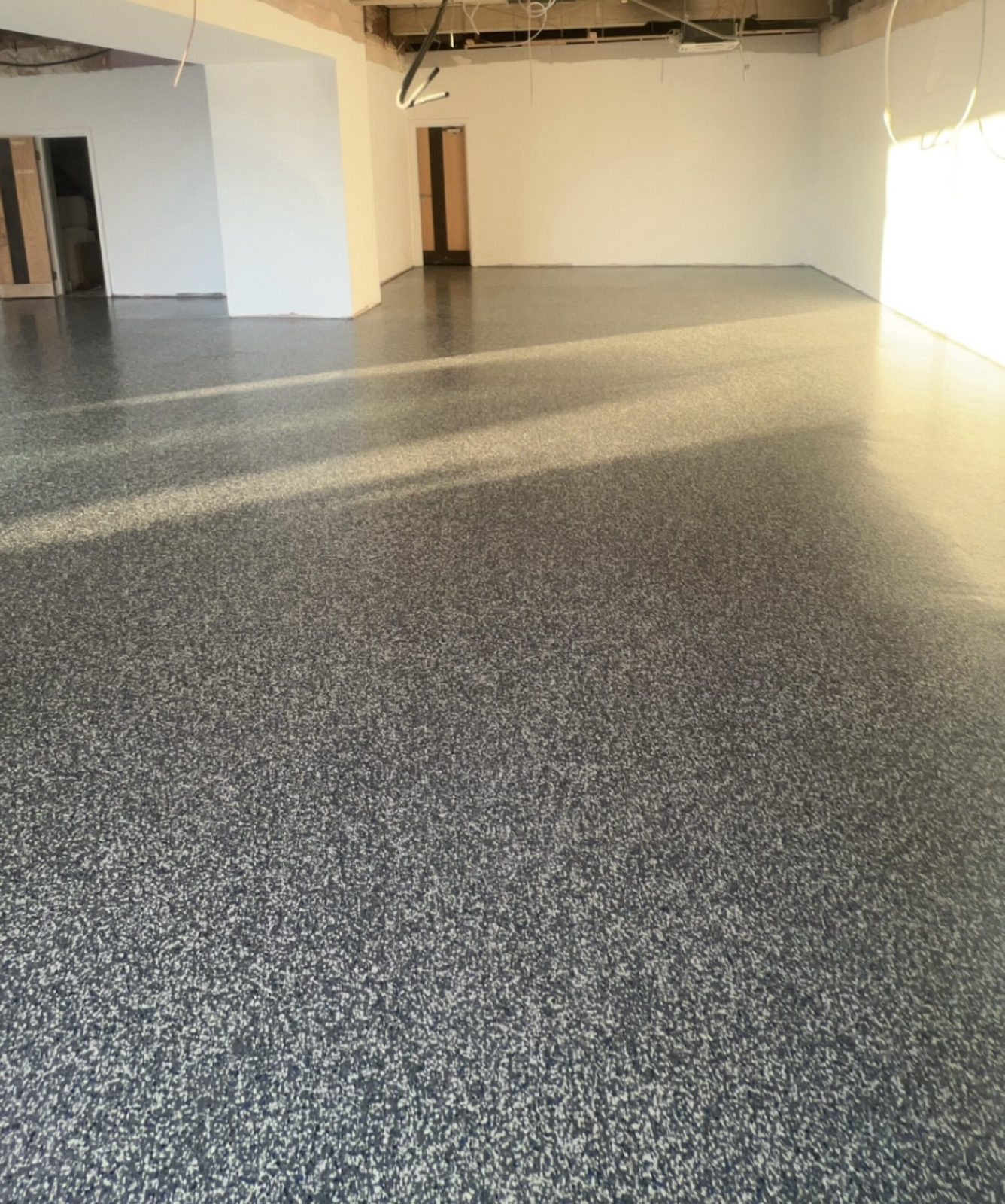 A decorative flake resin floor finish