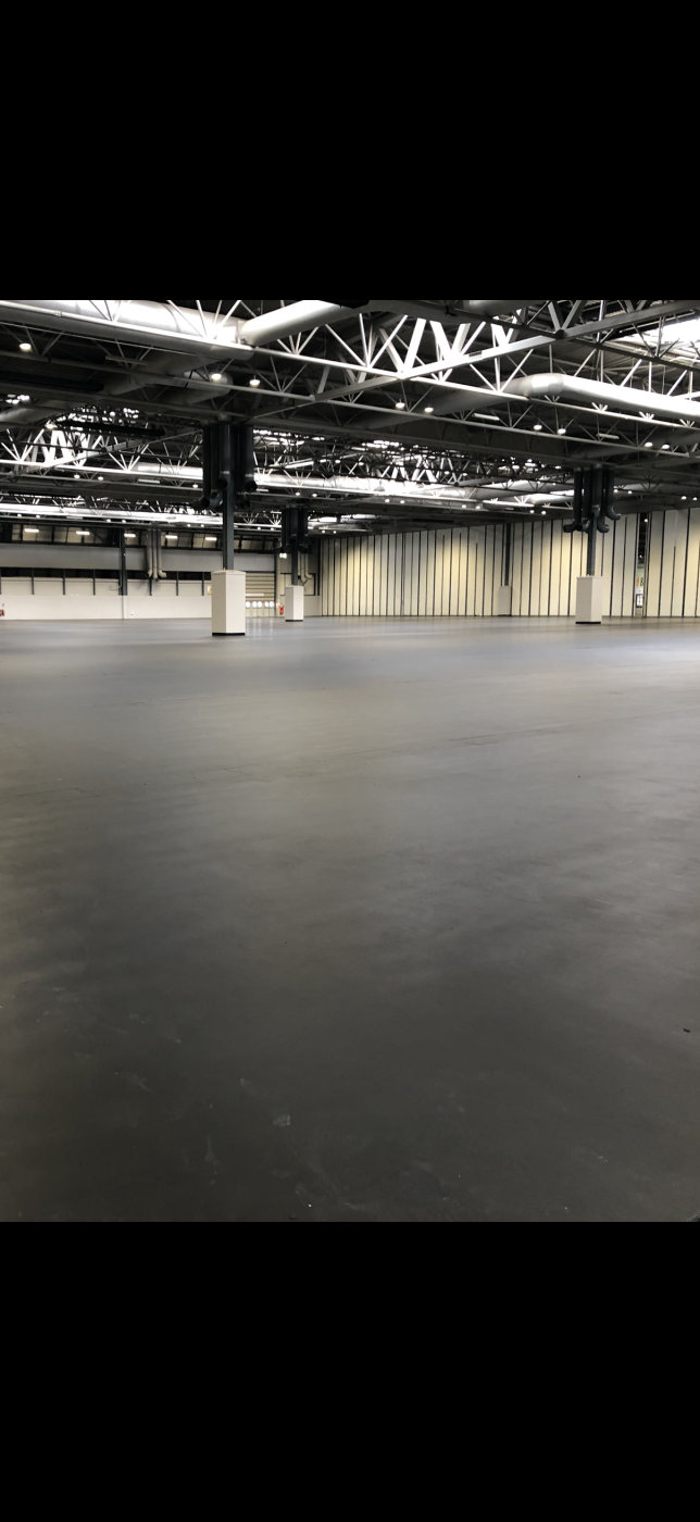 A large hall with a seamless resin floor maintained by Q-Line